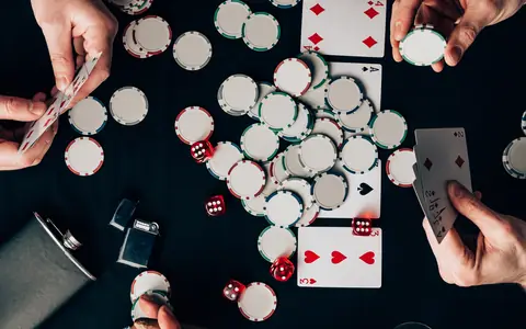 Poker game with chips, cards and drinks, illustrating the PPPoker legit and safe guide