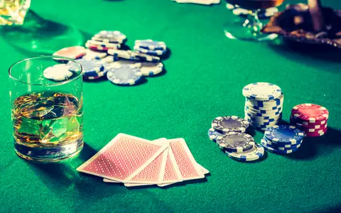 Poker chips and cards on a green felt table, a still life for the PPPoker Android download guide