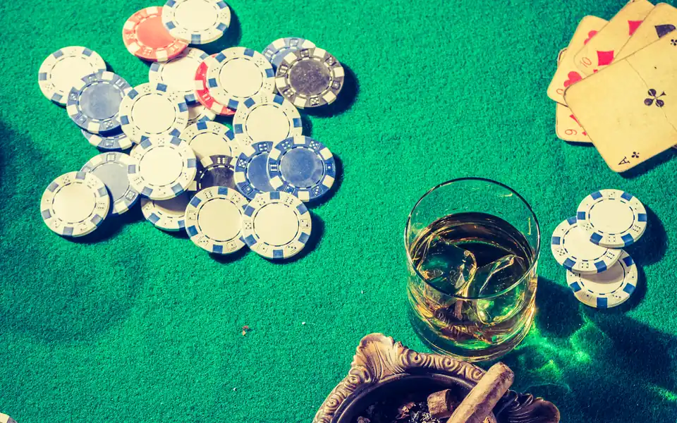 Casino chips and cards on a table, illustrating PPPoker chips, diamonds and bonuses