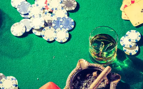Chips and cards on green felt, illustrating PPPoker strategy and bankroll management